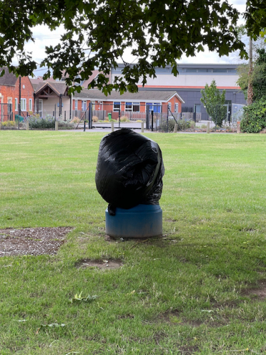 Shinfield litter bin shrouded in black plastic bag by WBC