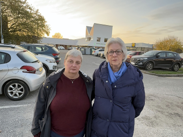 Jackie Rance and Pauline Jorgensen at a busy School Green car park.